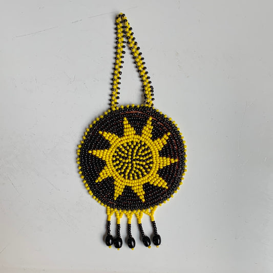 Yellow and black seed bead sun medallion