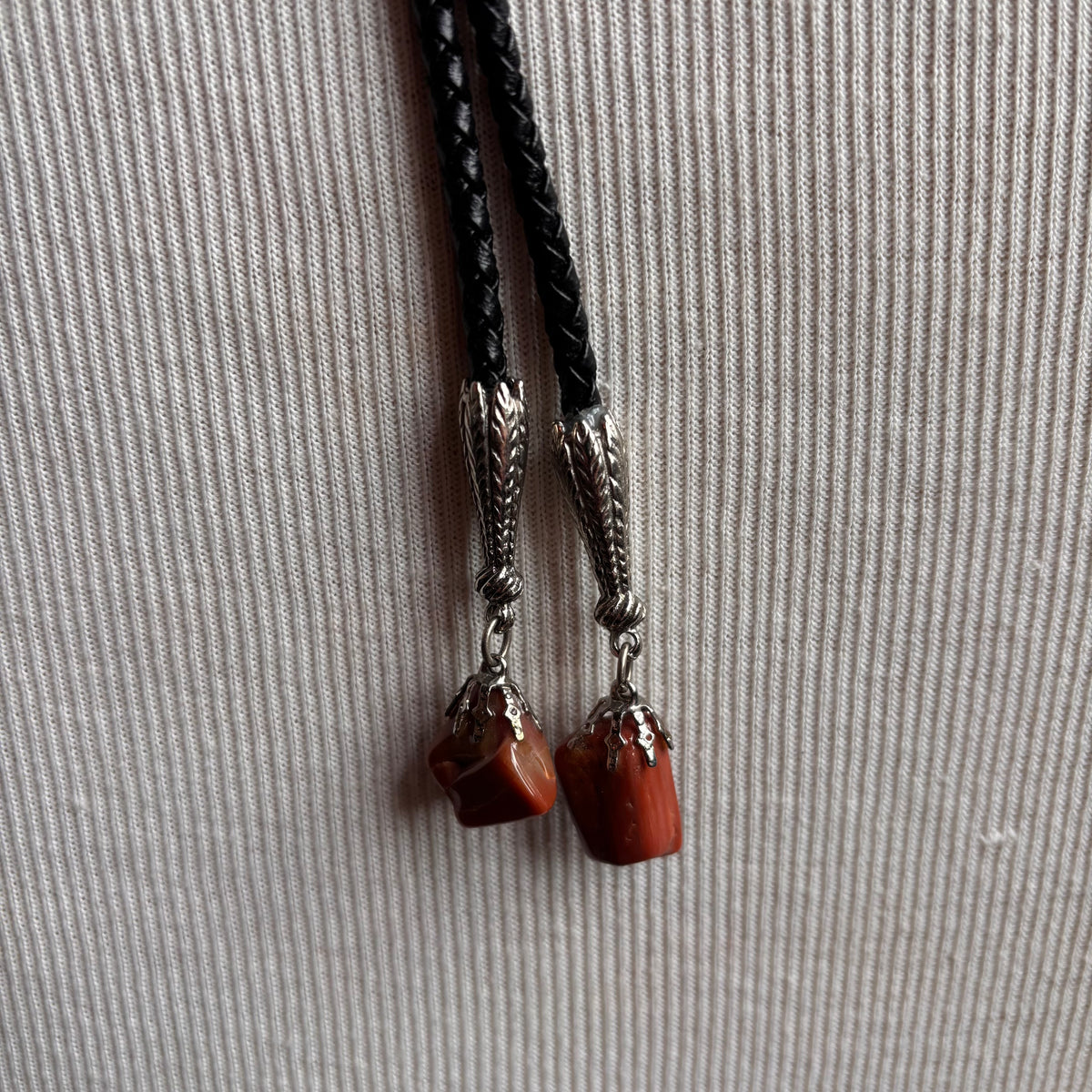 Pink Stone Chip Bolo on Black Leather Tie