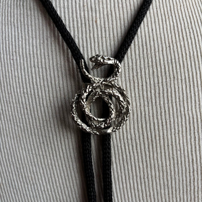 Silver Tone Snake Bolo on Black Tie