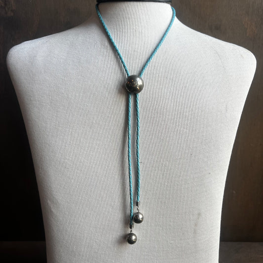 Silver Circle Bolo on Blue Cord