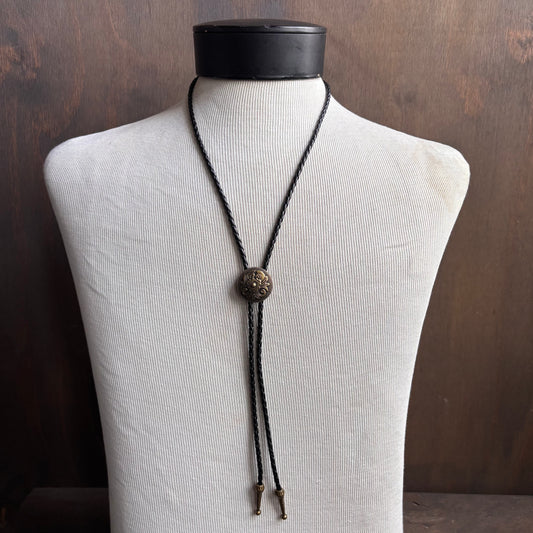 Metal Flower Bolo on Black Leather Tie