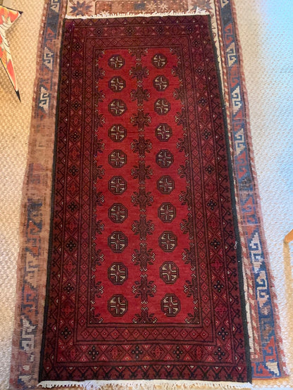 Dark red, black & cream area rug