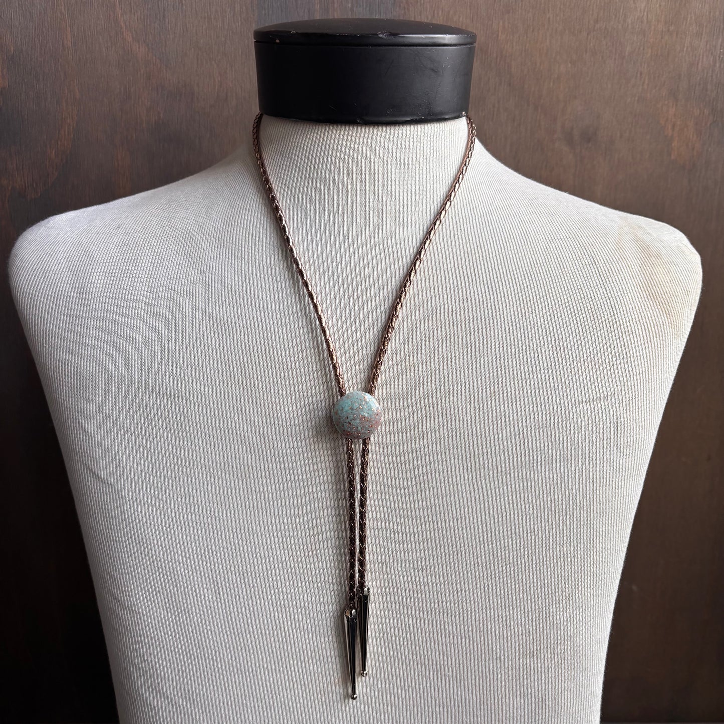 Light Blue Circle Bolo on Gold Leather Tie