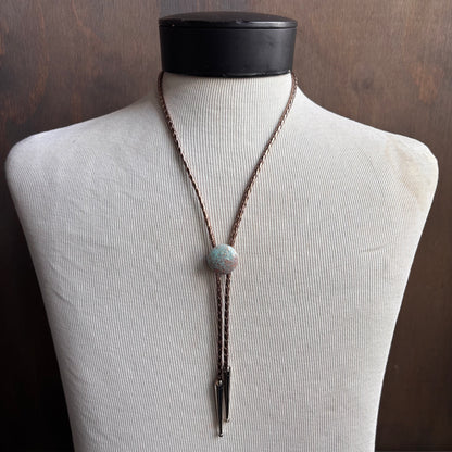 Light Blue Circle Bolo on Gold Leather Tie