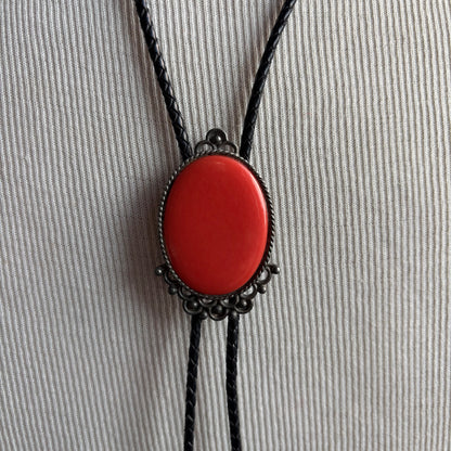 Red Oval Stone Bolo on Black Tie