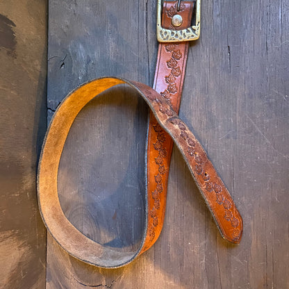 Leaf motif tooled leather belt with brass buckle