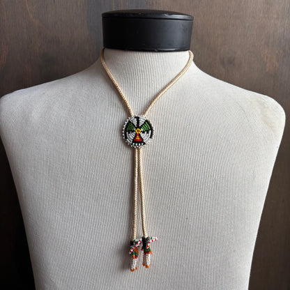 Seed Bead Thunderbird Bolo on Cream Tie