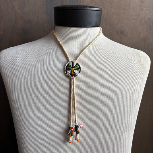 Seed Bead Thunderbird Bolo on Cream Tie