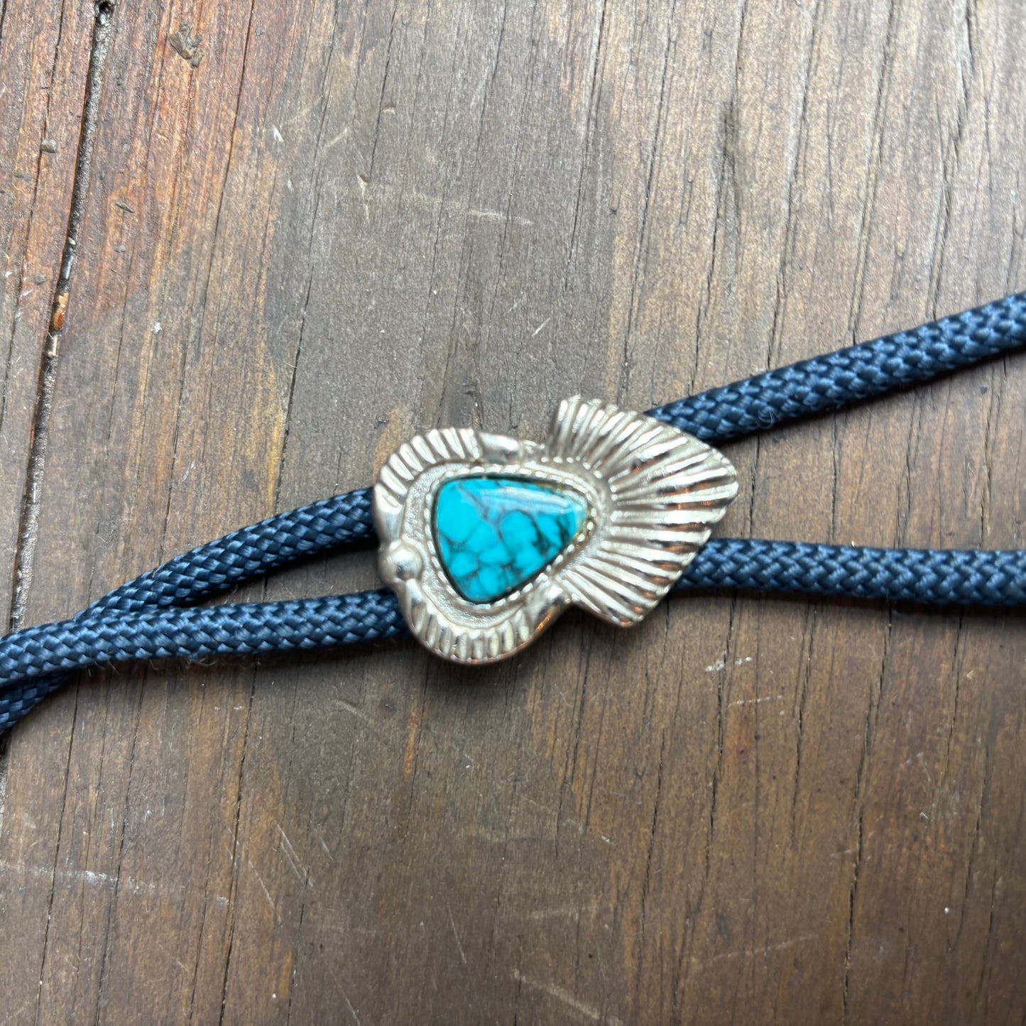 Blue Stone Bolo on Blue Tie