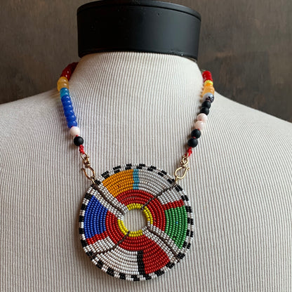 Ostrich Moon Multi colored beaded necklace with seed bead medallion