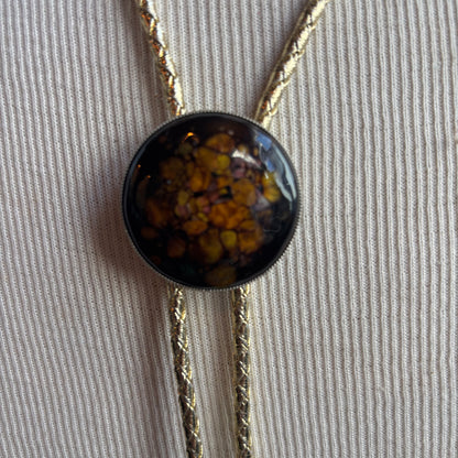Round Enamel Bolo on Gold Tie