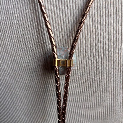 Light Blue Circle Bolo on Gold Leather Tie