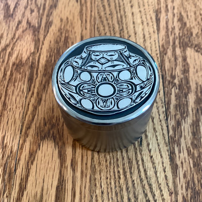 Small metal container with vase
