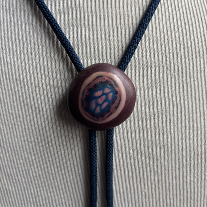 Clay Circle Bolo on Blue Tie