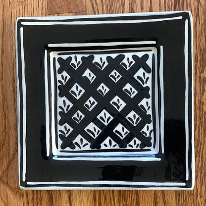 Black & white folk art style ceramic plate