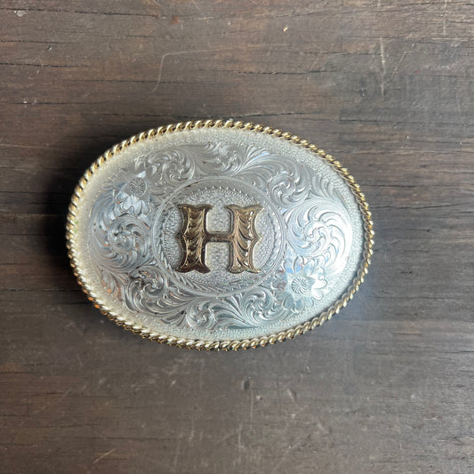 Silver Belt Buckle with Gold “H”