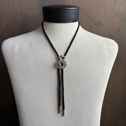Silver Tone Snake Bolo on Black Tie