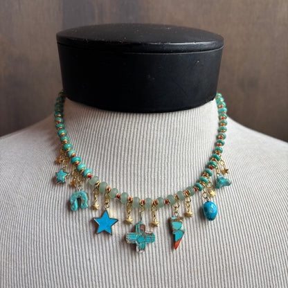 Ostrich Moon Turquoise Balanced Cross Necklace