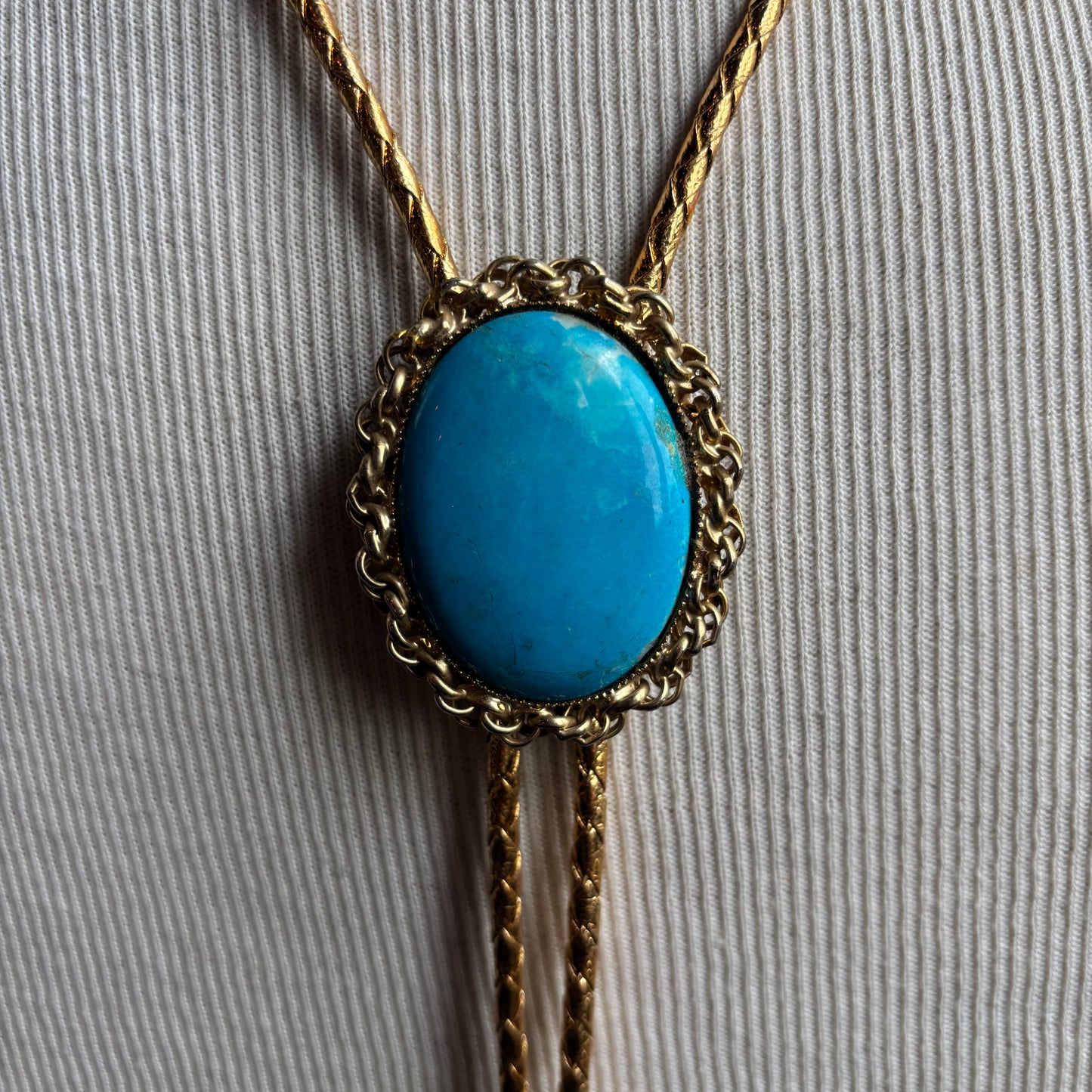 Oval Stone Bolo on Gold Tie