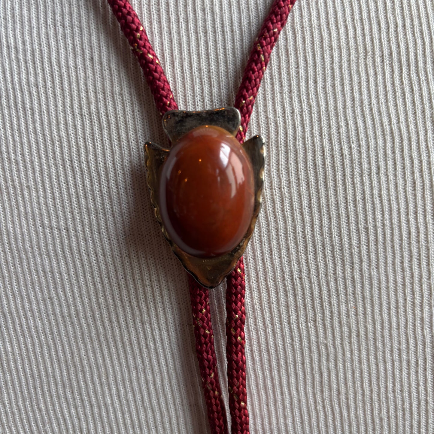 Arrowhead Bolo on Red Tie
