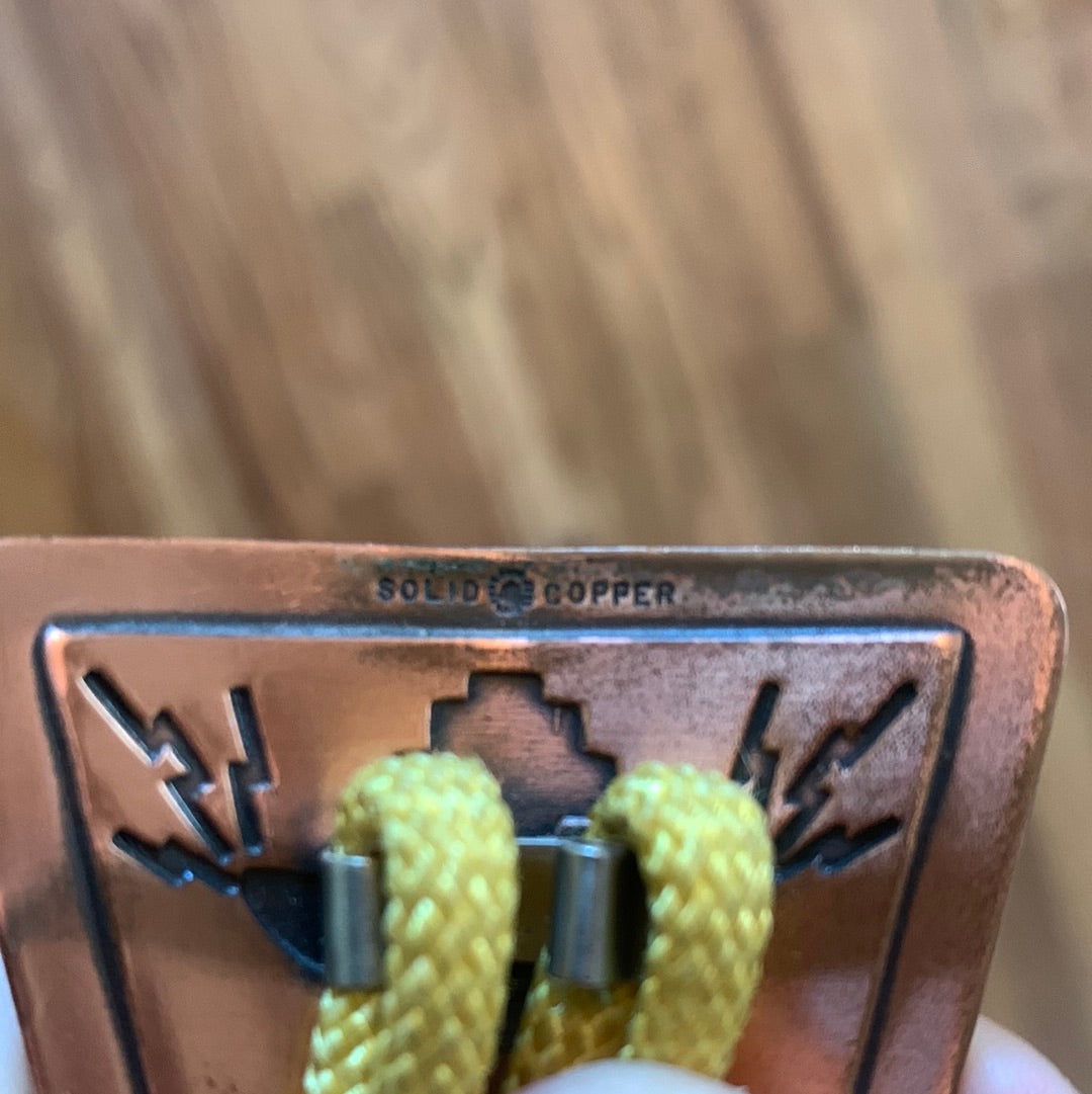 Graphic solid copper bolo on yellow cord