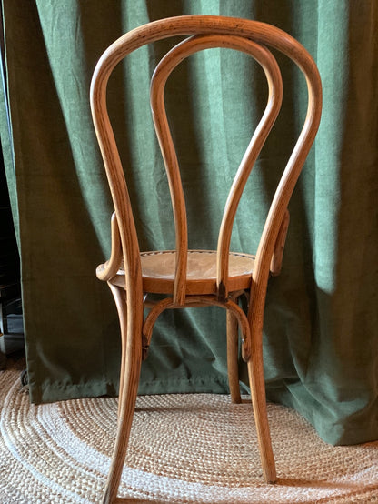 Vintage wood chair with tooled leather buck on seat