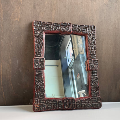 Vintage carved wood mirror with abstract shapes