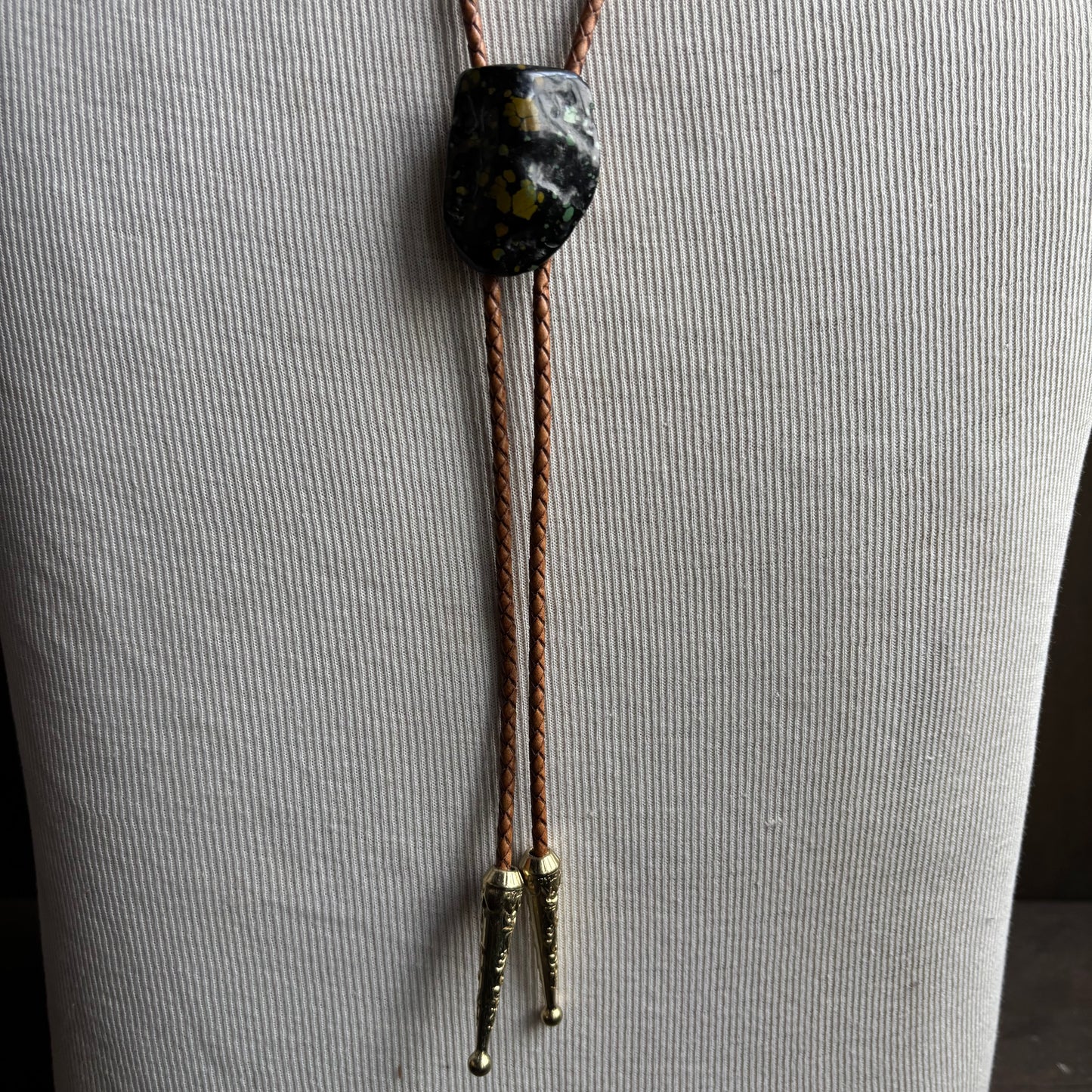 Speckled Stone Bolo on Tan Leather Tie