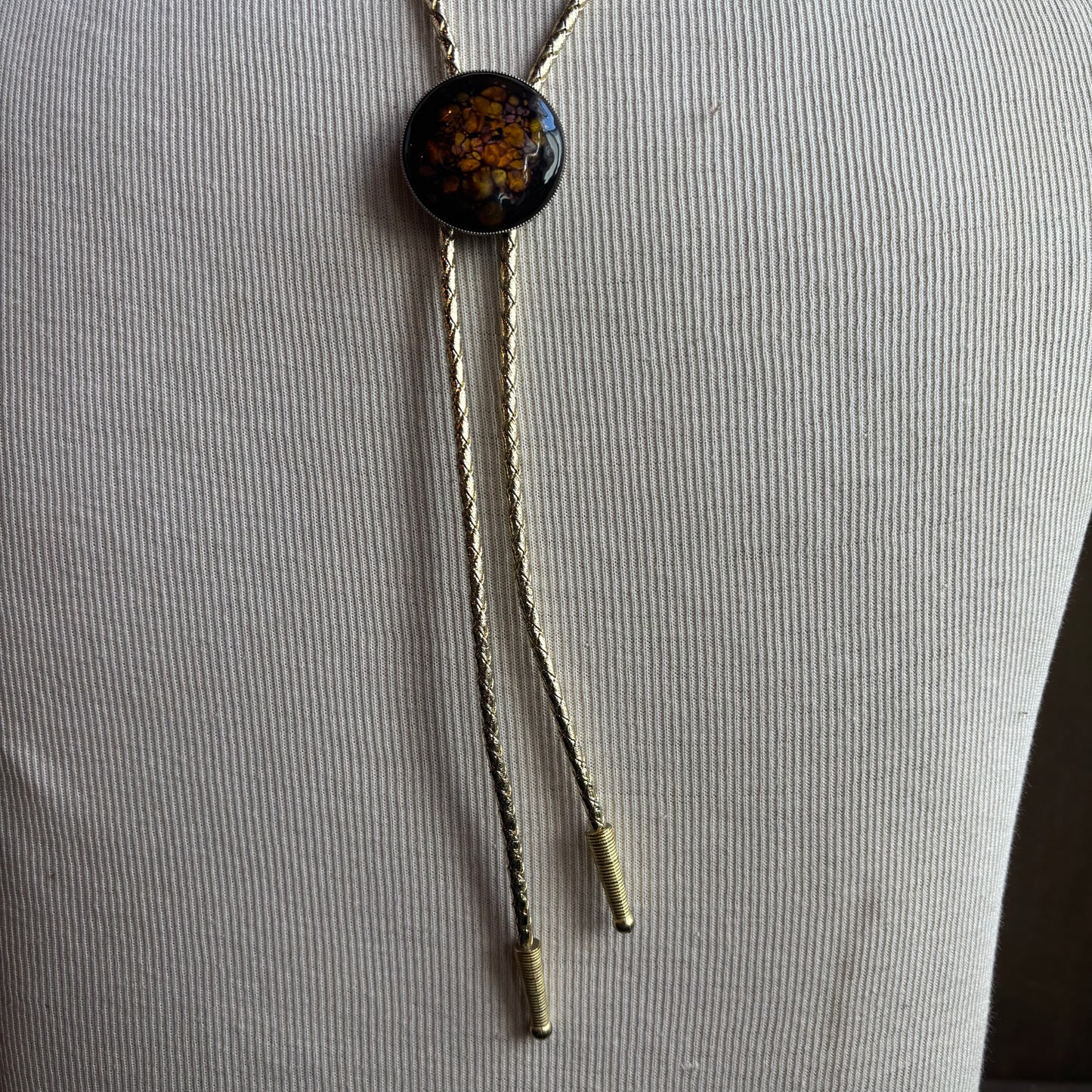 Round Enamel Bolo on Gold Tie