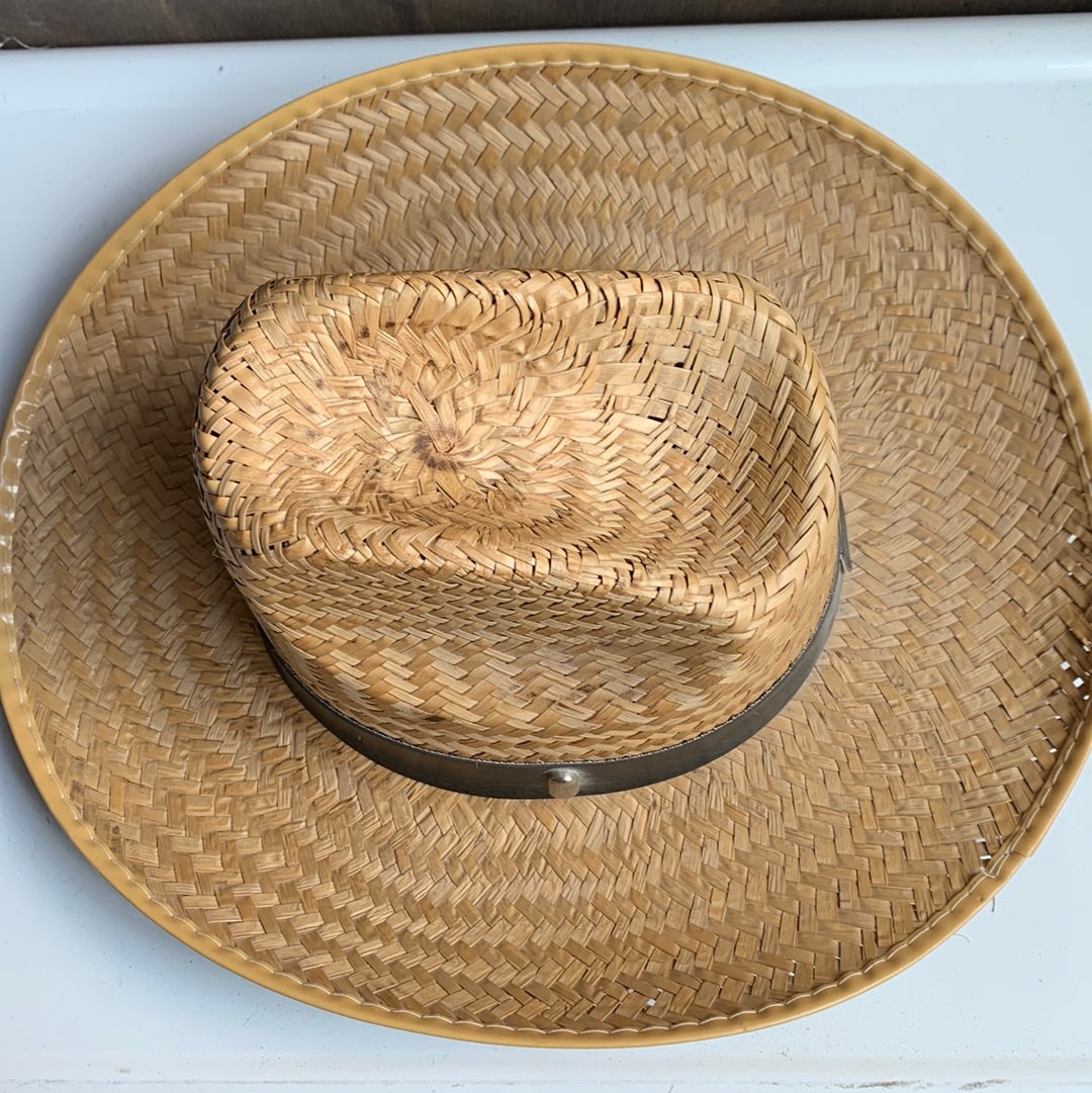 Straw cowboy hat with brown studded band