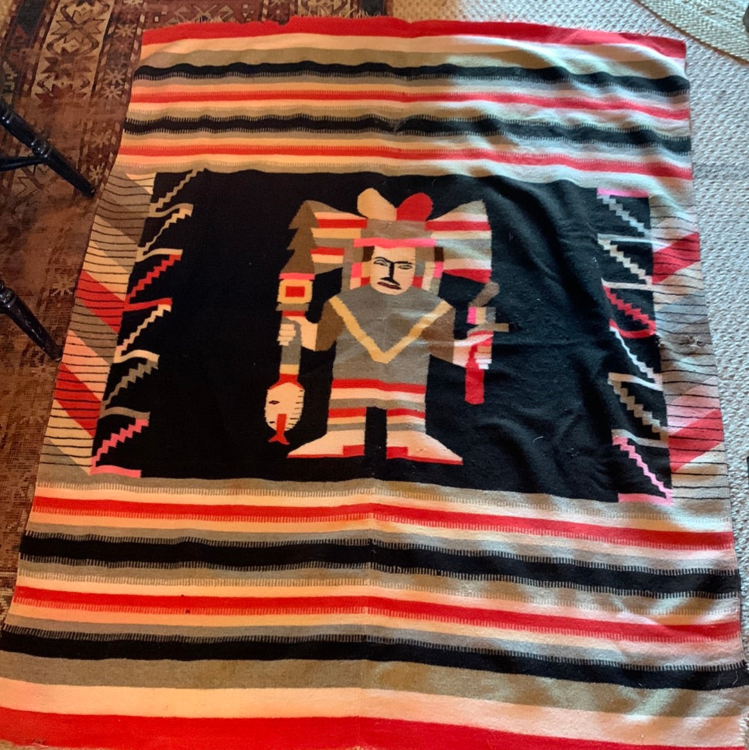 Colorful woven blanket with graphic figure