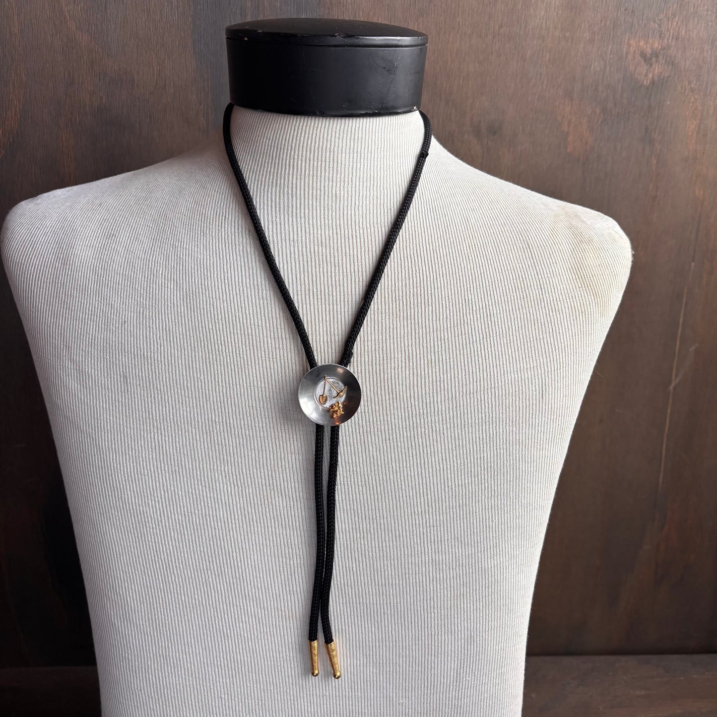 Vintage Gold Mining Bolo on Black Tie