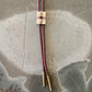 Silver compass with brown cord