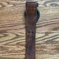 Wide leather belt with circular buckle