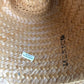 Brown trimmed straw Western hat