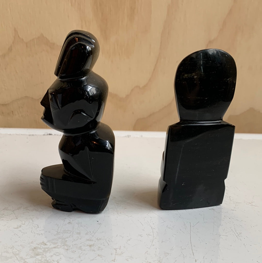 Black stone statues
