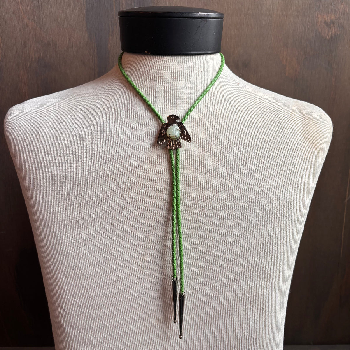 Thunderbird Bolo on Green Leather Tie