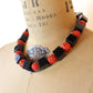 Carved red black bead necklace